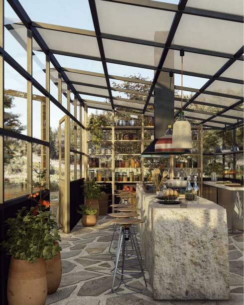 Bistrô na Estufa, por Linha + Idipi + Aia | No terreno em volta, há uma fogueira cercada por um banco, uma mesa grande em pedra contornando uma árvore local e a horta. Repare ainda no volume do banheiro e um tanque, em um módulo revestido em chapa perfurada de aço.