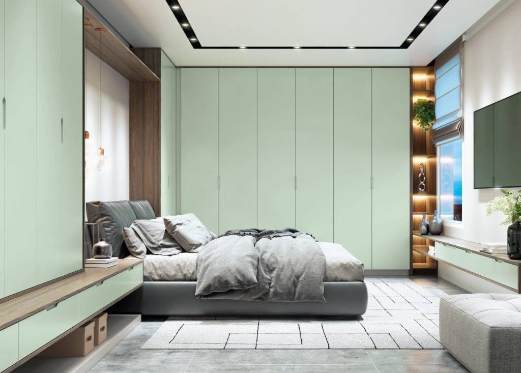 design-biofilico-casa.com-criare-1 Quarto com piso de cimento queimado, com armários na cor verde claro