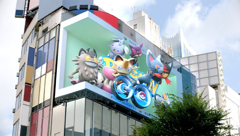 Este anúncio de Pokemón 3D salta da tela Designboom (2) Outdoor tridimensional em esquina de prédio com pokemon.