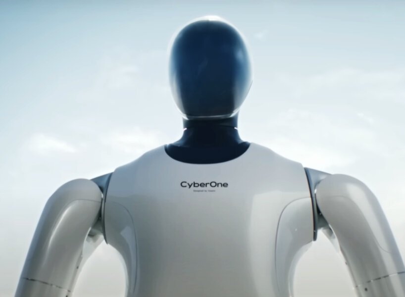 O robô da Xiaomi detecta 45 emoções Designboom (2) Robô humanoide com carcaça em preto e branco.
