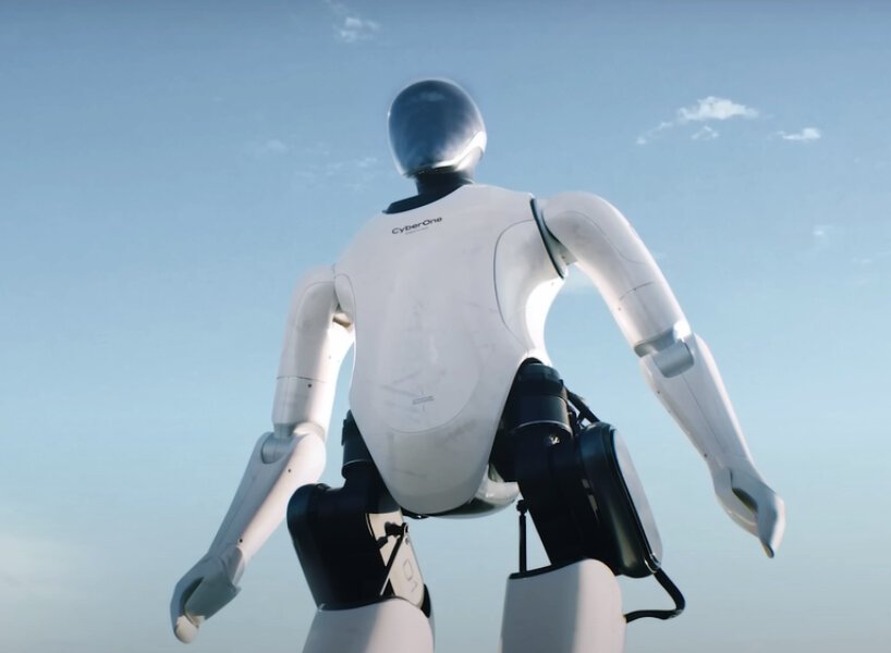 O robô da Xiaomi detecta 45 emoções Designboom (3) Robô humanoide com carcaça em preto e branco.