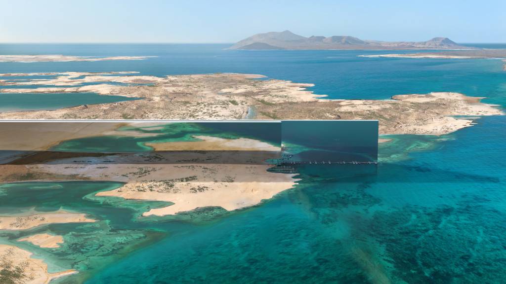 Um prédio de 170km para 9 milhões de pessoas Dezeen (5) Prédios em forma de muralhas correm paralelos em região desértica a costa de um mar azul.
