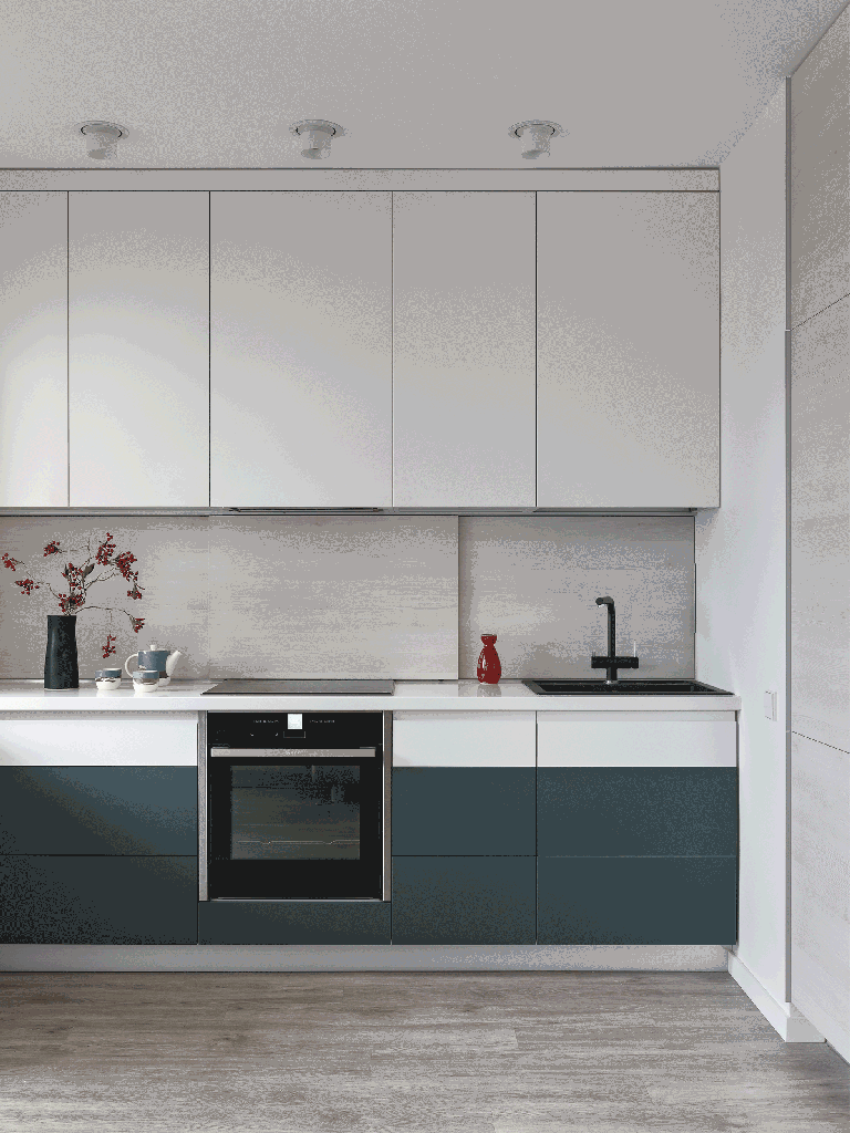 backsplash-armazenamento-oculto-ape-78m-epstein-01-cozinha-gif Cozinha minimalista com armários brancos e verdes; backsplah com espaço de armazenamento.