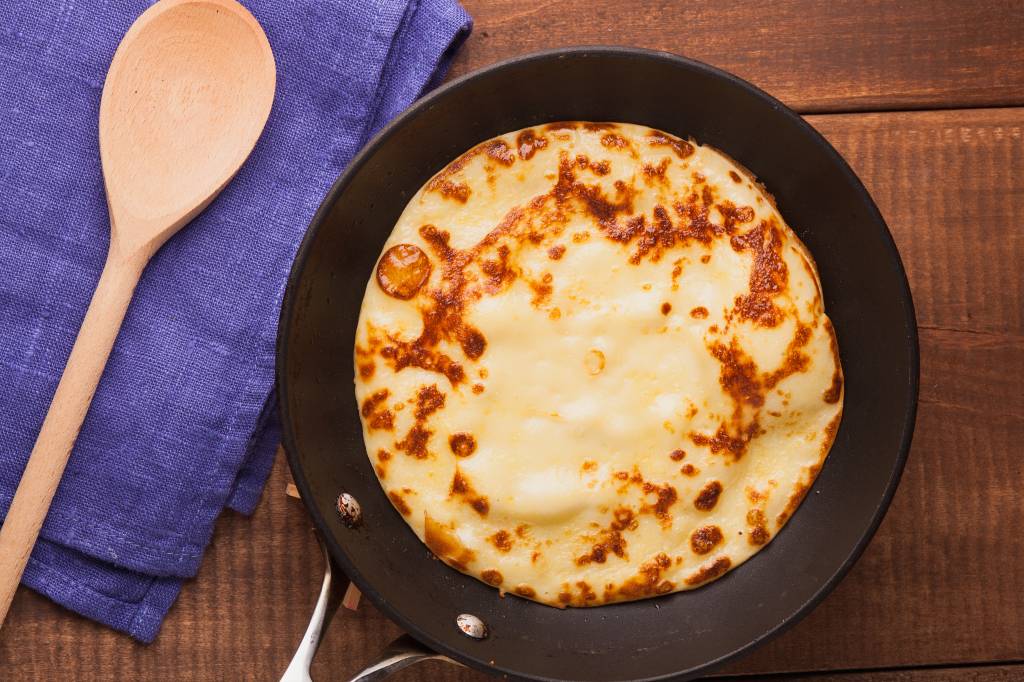 Homemade,Pancakes,On,A,Frying,Pan,With,Wooden,Spoon,Cream Homemade,Pancakes,On,A,Frying,Pan,With,Wooden,Spoon,Cream